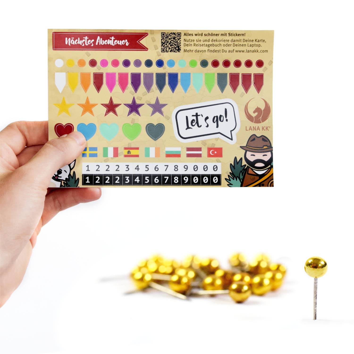 Dein Starterkit Leinwand beinhaltet ein Stickerset und 25 goldene Pins zum Markieren Deiner Abenteuer.